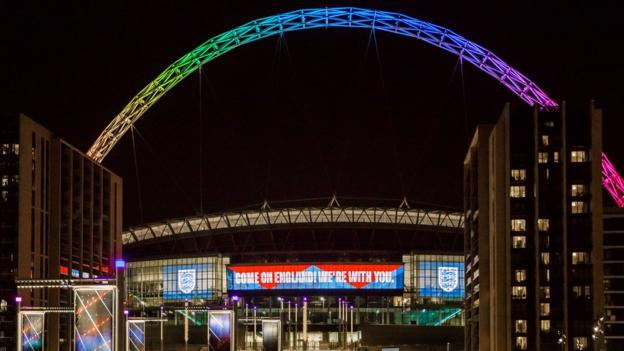 The Wembley arch lit up in rainbow colours