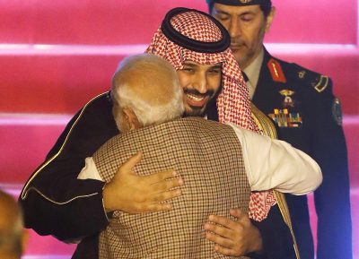 Saudi Arabia's Crown Prince Mohammed bin Salman hugs India's Prime Minister Narendra Modi upon his arrival at an airport in New Delhi, India, 19 February 2019. (PHOTO: Adnan Abidi via Reuters Connect).