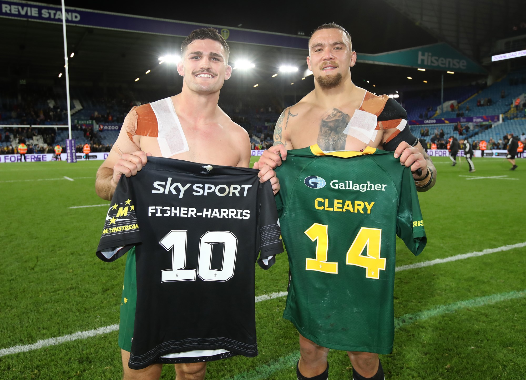 Nathan Cleary and James Fisher-Harris hold one another's jerseys after their Rugby League World Cup semifinal.