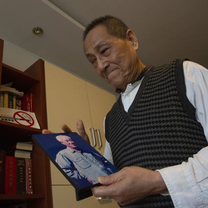 Bao Tong, aide to the late reform-minded former Communist Party general secretary Zhao Ziyang, holds a photo of Zhao as he speaks at his home in Beijing on April 23, 2014. Bao, a leading voice for political reform in the Communist Party who was purged after the 1989 Tiananmen Square crackdown, died on November 9 at age 90. Photo: AP