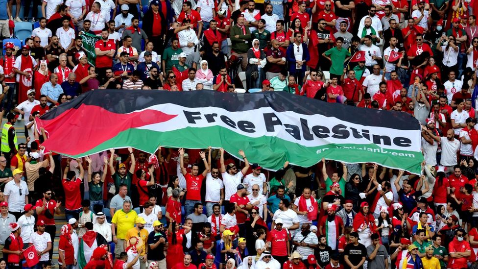 Tunisian fans holding up a large "Free Palestine" banner during the match against Australia