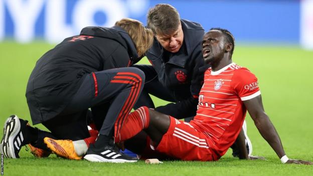 Sadio Mane reacts after suffering an injury while playing for Bayern Munich