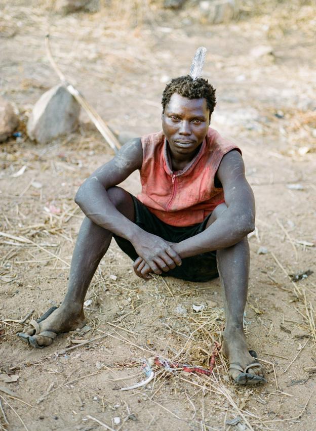 A Hadza man poses for a portrait
