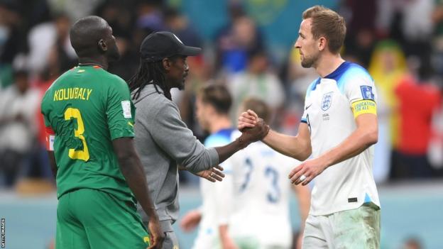 Senegal coach Aliou Cisse congratulates England captain Harry Kane following England's 3-0 win in the Round of 16 game