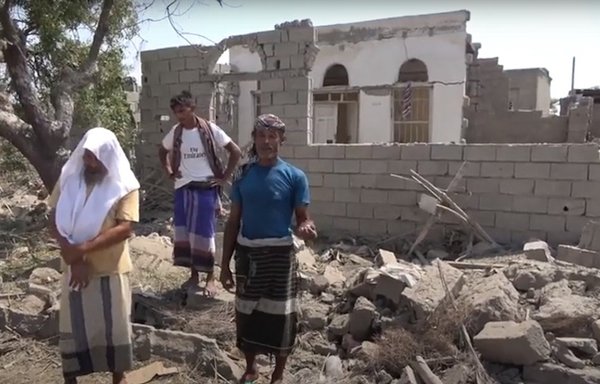 A screen grab shows Yemenis standing in front of their house after it was demolished by a ballistic missile launched by the Houthis on a residential neighborhood in al-Hodeidah, in October 2020. [Media Centre of the Southern Giants Brigades]