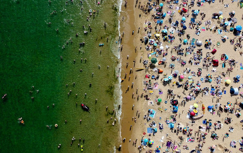 People and children enjoy the hot weather at Bournemouth Beach, 17 June 2022