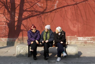 Elderly people rest in a park in Nanchong city, southwest China's Sichuan province, 16 January 2015 (Photo: Reuters/Oriental Image).