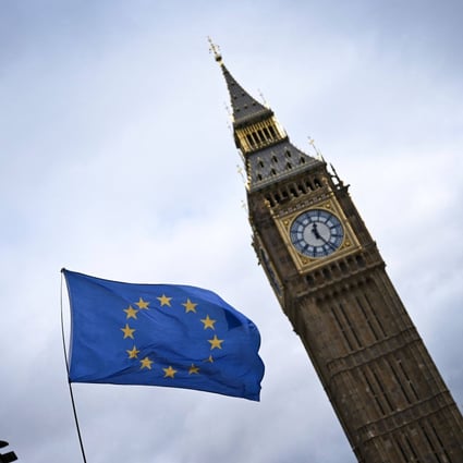 A European Union flag, flown by anti-Brexit activists, flaps in wind, in front of the Elizabeth Tower, commonly known as Big Ben, in central London on March 1. Britain agreed on Friday to join the Comprehensive and Progressive Agreement for Trans-Pacific Partnership, its biggest trade deal since leaving the European Union three years ago. Photo: AFP 