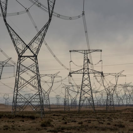 Ultra-high voltage and other high-voltage power lines near a solar farm in China’s Qinghai province. When compared with pumped storage, new-energy storage is more flexible when it comes to site selection, and has other advantages, including short construction periods, faster and flexible response and more diverse functions. Photo: Bloomberg