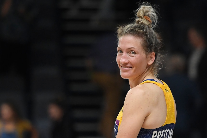 Pretorius looks over her shoulder and smiles