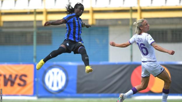 Tabitha Chawinga of Inter Milan leaps high to volley the ball