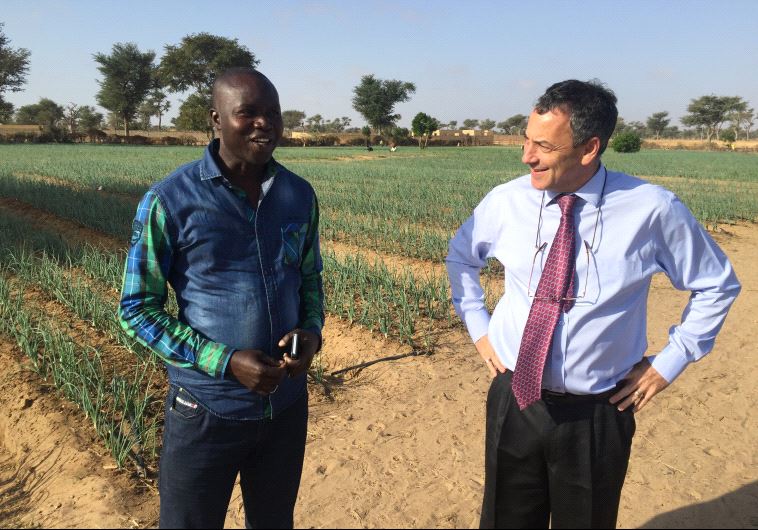 Ambassador Paul Hirschson at a small farm project supported by Israel in Senegal in March (credit: SETH J. FRANTZMAN)