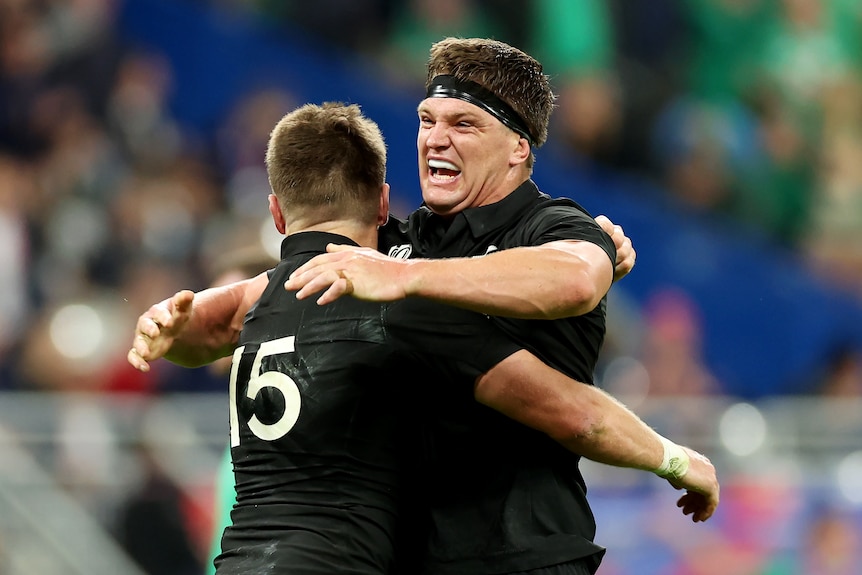Beauden and Scott Barrett hug after the All Blacks' win