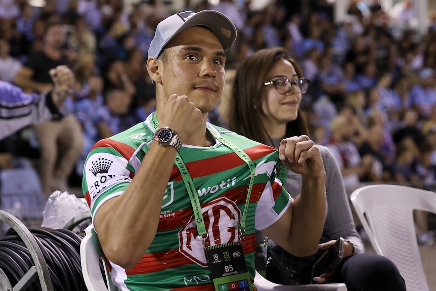 Tim Tszyu holds up a South Sydney jersey
