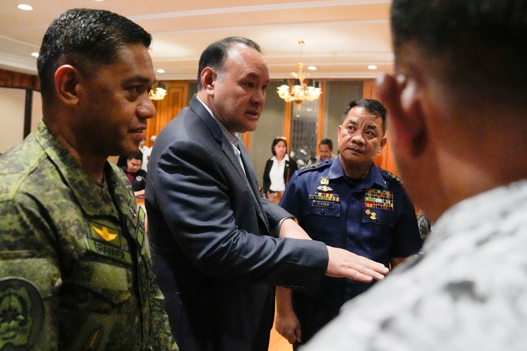 Philippines defence chief Gilbert Teodoro (centre), talks with military chief General Romeo Brawner Jr. (left) and Coast Guard chief Admiral Ronnie Gil Latorilla Gavan (right) on Monday at the Malacanang compound in Manila. Photo: AP