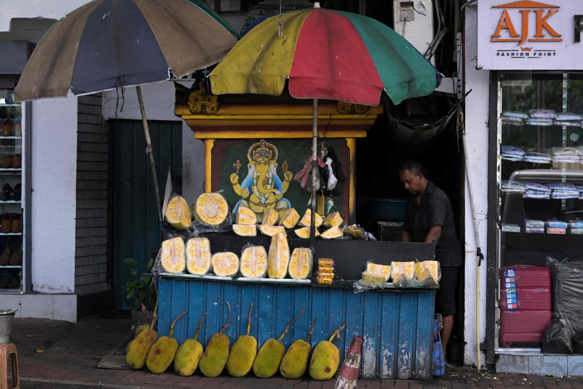A vendor selling jackfruit waits for customers at a stall in Colombo in September. Photo: AFP