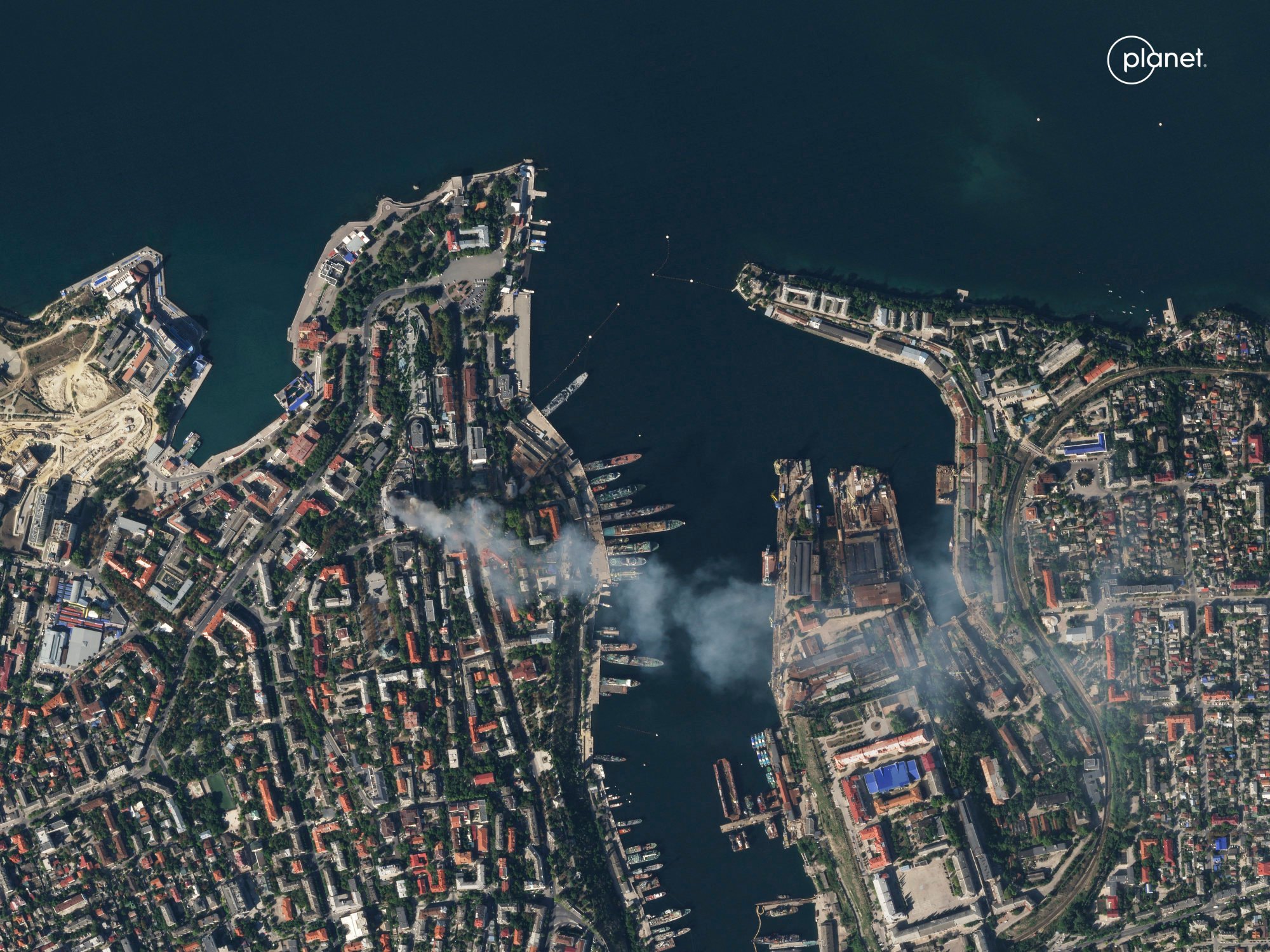 Smoke billows from the headquarters for the Russian Black Sea fleet in Sevastopol, Crimea, after it was struck by a missile on September 22. Photo: Planet Labs via AP