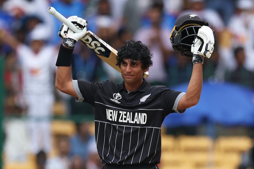 Rachin Ravindra holds up his bat