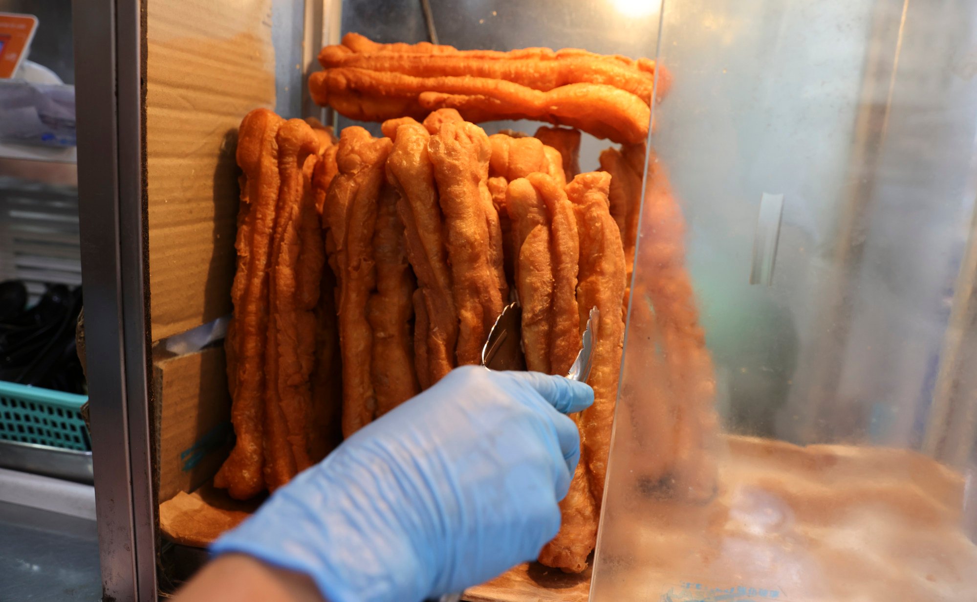 Fried dough sticks at a restaurant in Sham Shui Po. Lawmakers passed legislation banning artificial trans fats in 2021 and the grace period for food providers to find an alternative ends on November 30. Photo: Yik Yeung-man