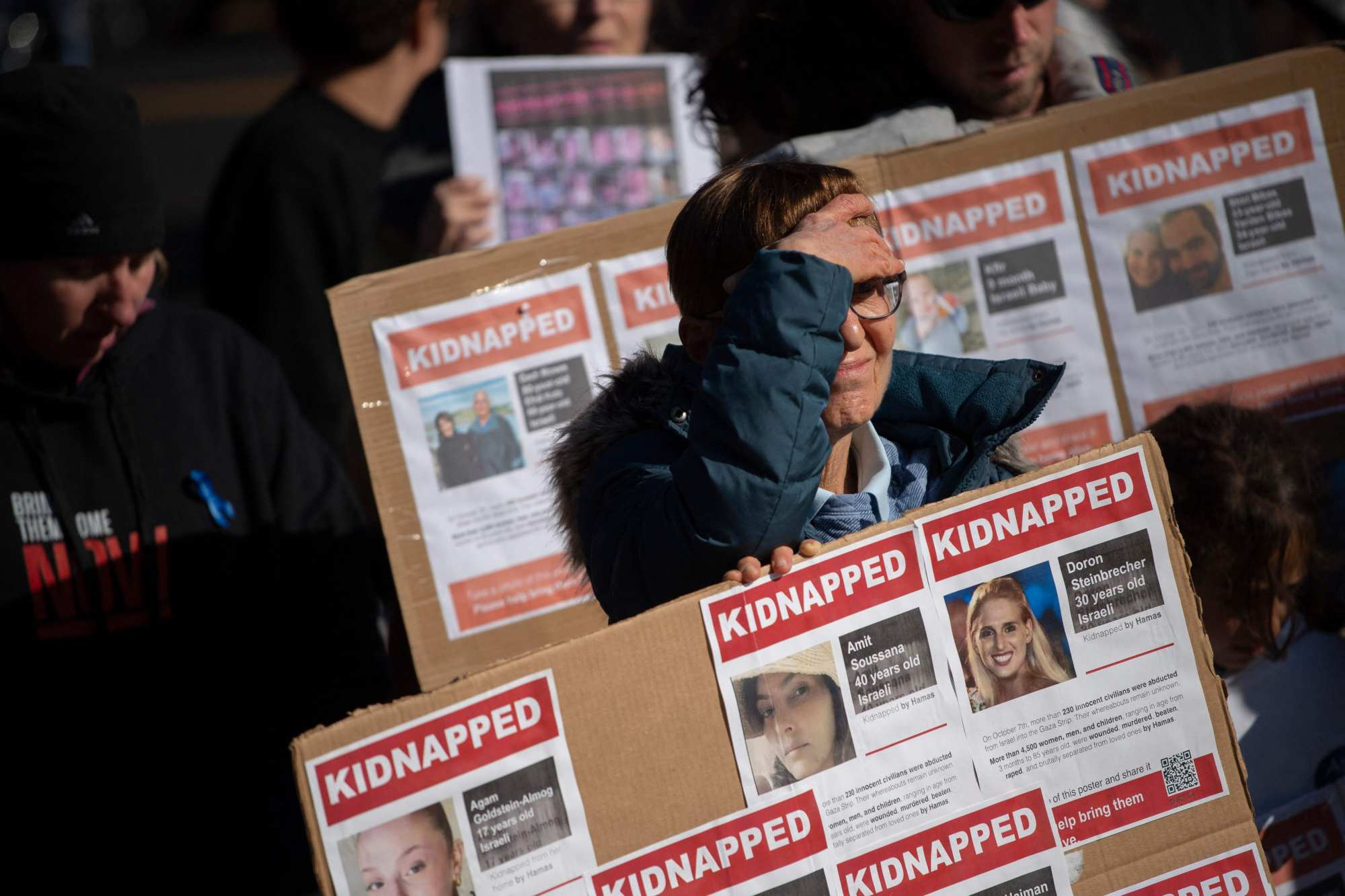 People hold signs in Washington on Sunday as they gather to ask for the safe return of hostages held in Gaza after the October 7 attack on Israel by Hamas. Photo: AFP