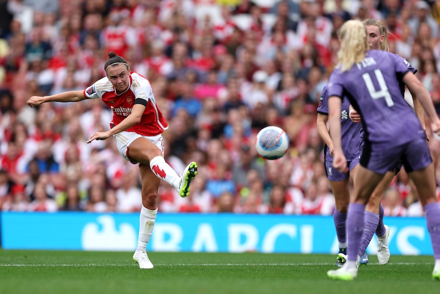 Caitlin Foord takes a shot as Liverpool defenders look on