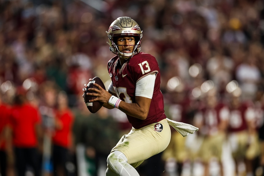Jordan Travis prepares to throw the ball