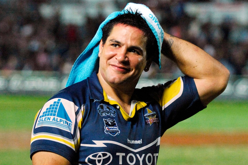Carl Webb smiles as he looks to the crowd after a 2008 North Queensland Cowboys NRL match.