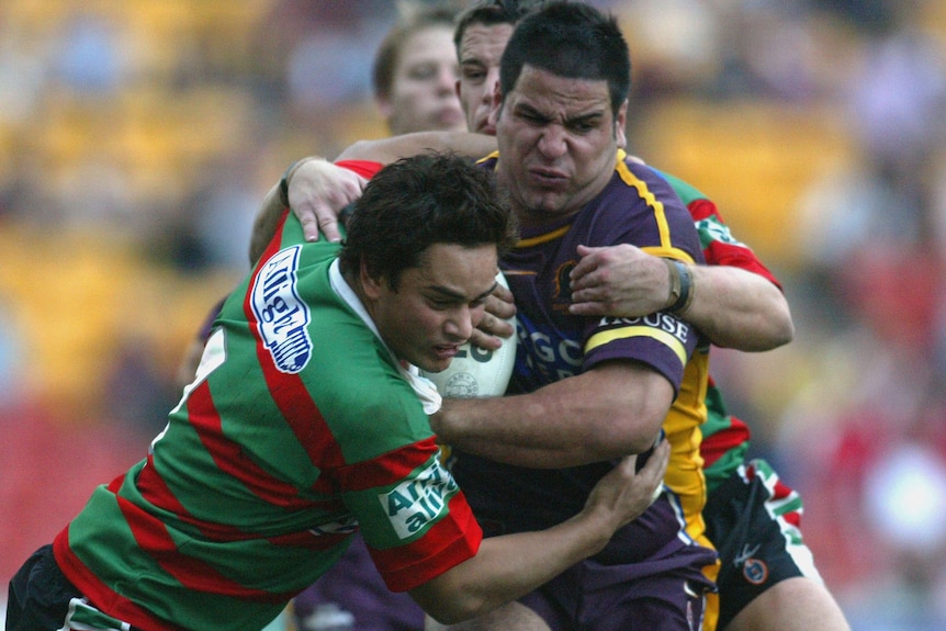 Carl Webb carrying the ball while playing for the Brisbane Broncos against South Sydney in 2004.
