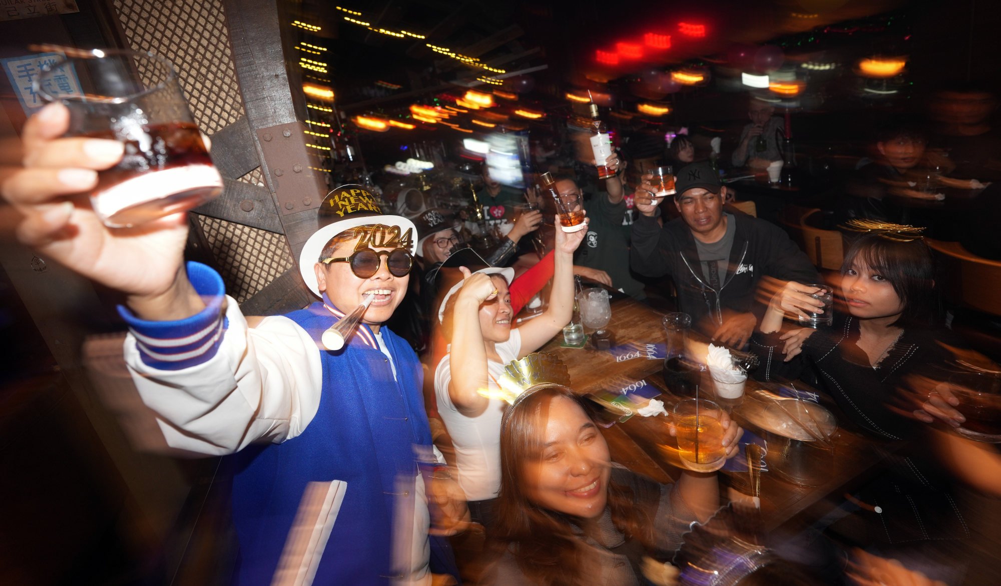 Revellers get into the party mood in Lan Kwai Fong. Photo: Eugene Lee
