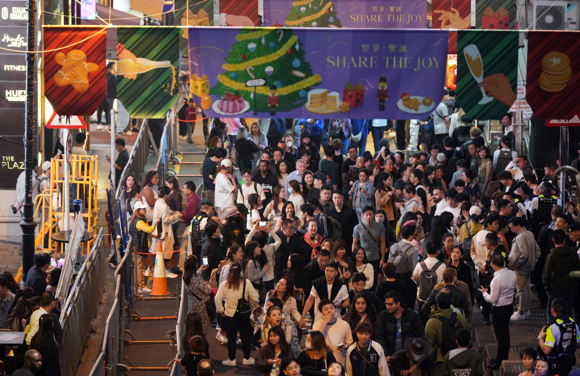 Revellers gather in the Lan Kwai Fong nightlife area to ring in the new year. Photo: Eugene Lee
