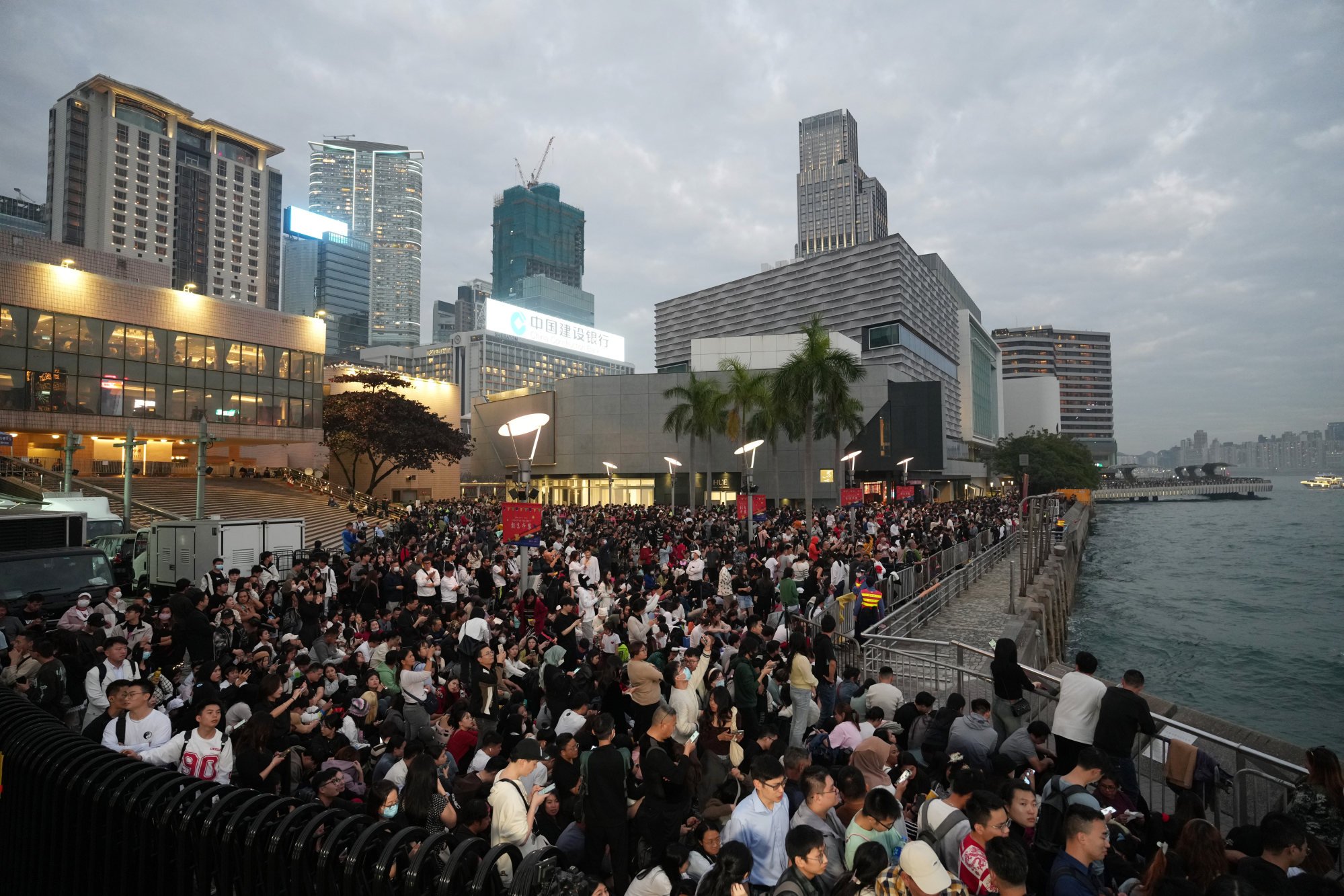 The Tsim Sha Tsui harbourfront is packed hours ahead of the fireworks display. Photo: Sam Tsang