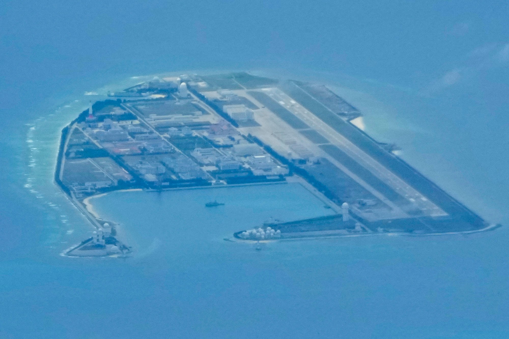Chinese structures and buildings are seen on a man-made island on Mischief Reef in March. Photo: AP