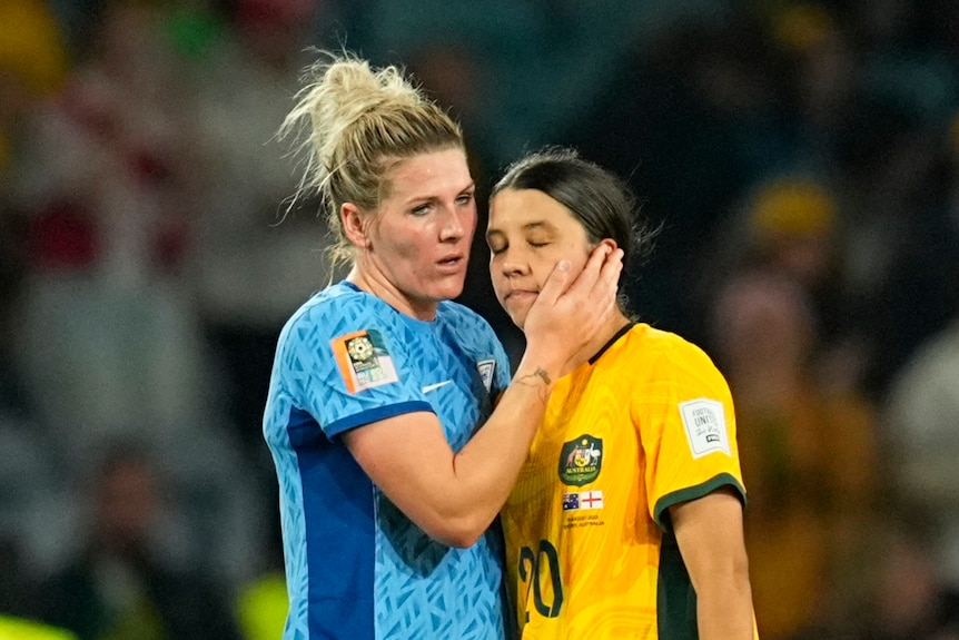 Sam Kerr is hugged by Millie Bright