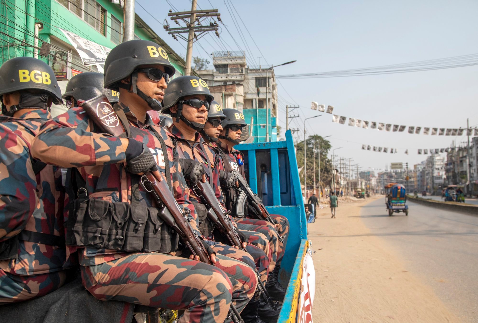 Bangladesh border guards patrol during the 12th national general election at Keraniganj Upazila, on the outskirts of Dhaka, Bangladesh on Sunday. Photo: EPA-EFE