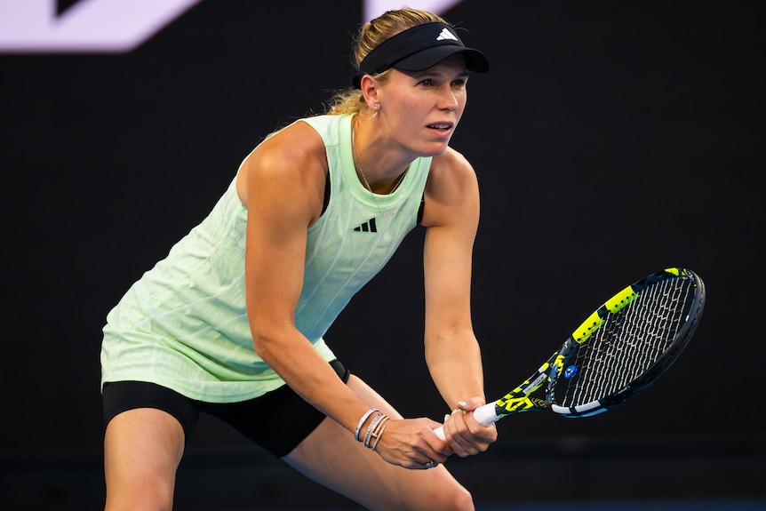 Caroline Wozniacki prepares to receive a serve.