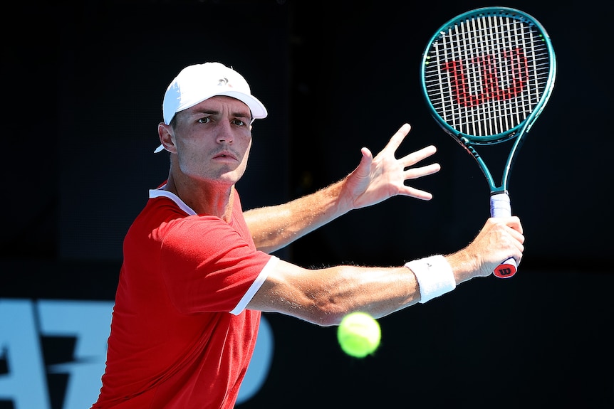 Christopher O'Connell watches intently as he prepares to play a backhand