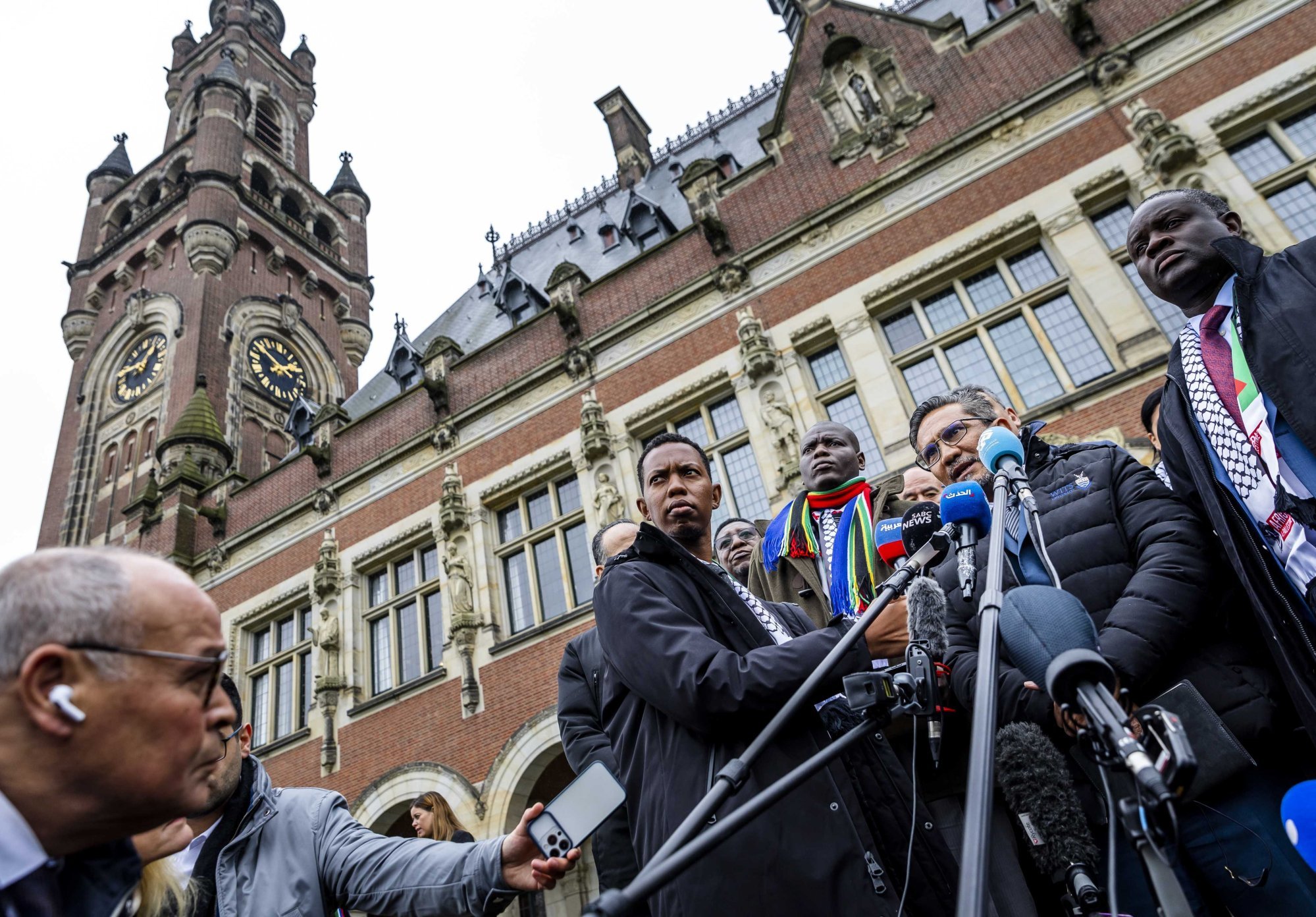The South African delegation speaks to the press in front of the International Court of Justice on January 12 after the second day of the hearing of the genocide case against Israel. Photo: EPA-EFE