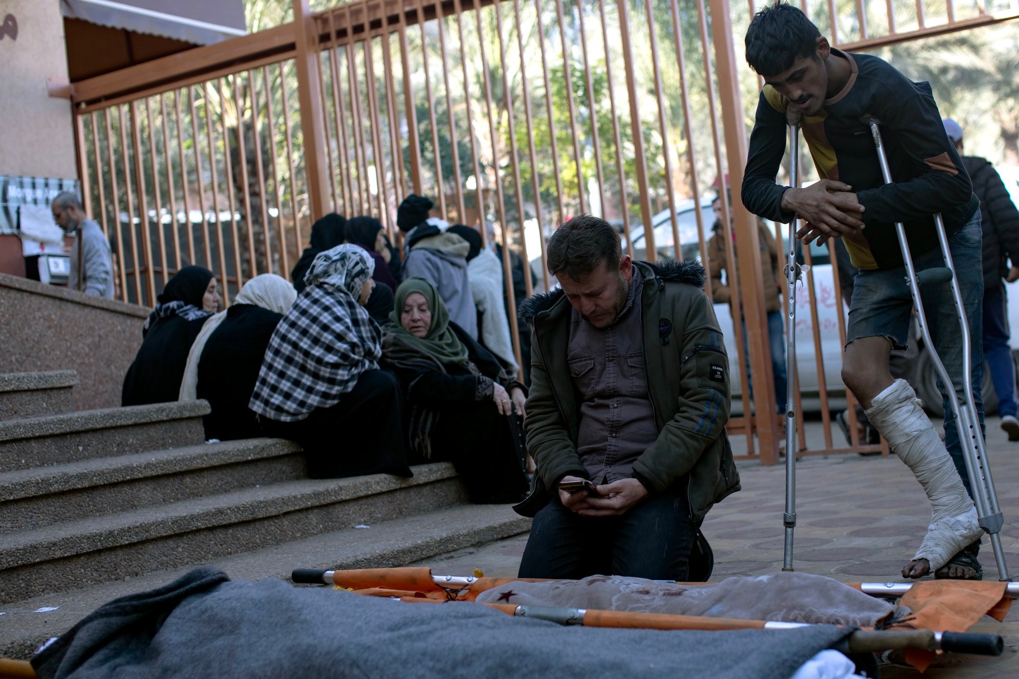 Relatives of Palestinians killed during an Israeli air strike mourn in front of their wrapped bodies outside Nasser Hospital in Khan Younis, southern Gaza Strip, on Saturday. Photo: EPA-EFE