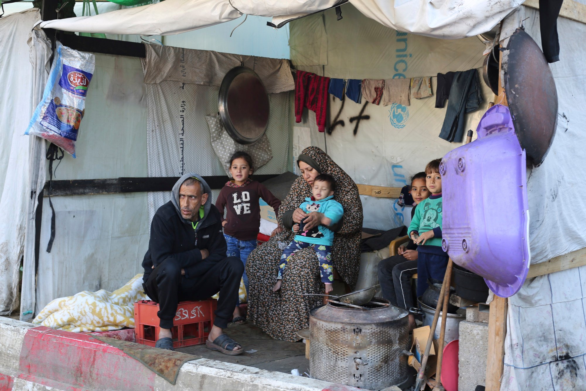 Palestinians displaced by the Israeli bombardment of the Gaza Strip take shelter at European Gaza Hospital in Rafah on Saturday. Photo: AP