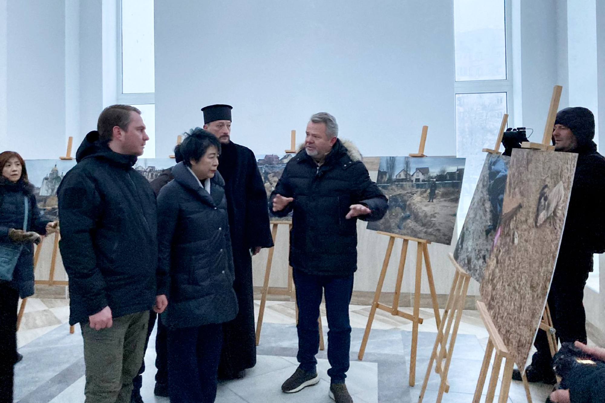 Japan’s Foreign Minister Yoko Kamikawa, third left, visits the town of Bucha in Ukraine on Sunday. Photo: Handout / Embassy of Japan in Ukraine / AFP