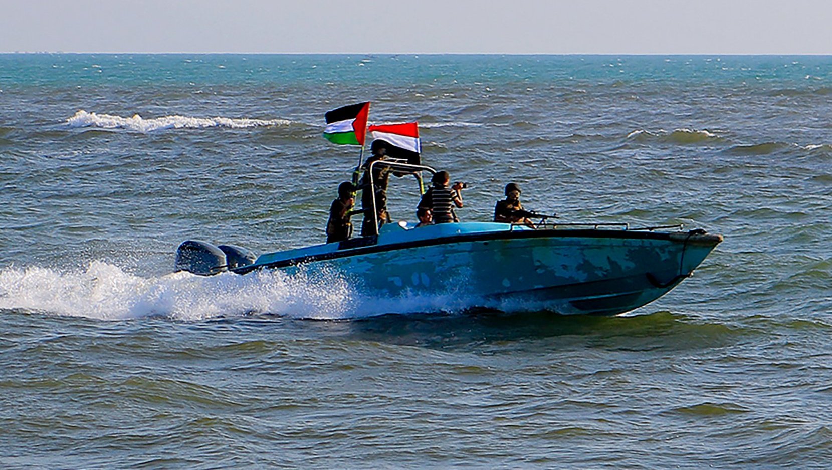 Members of the Yemeni Coast Guard affiliated with the Houthi group patrol the sea as demonstrators march through the Red Sea port city of Hodeida in solidarity with the people of Gaza on January 4, 2024, amid the ongoing battles between Israel and the militant Hamas group in Gaza. (Photo by AFP) (Photo by -/AFP via Getty Images)