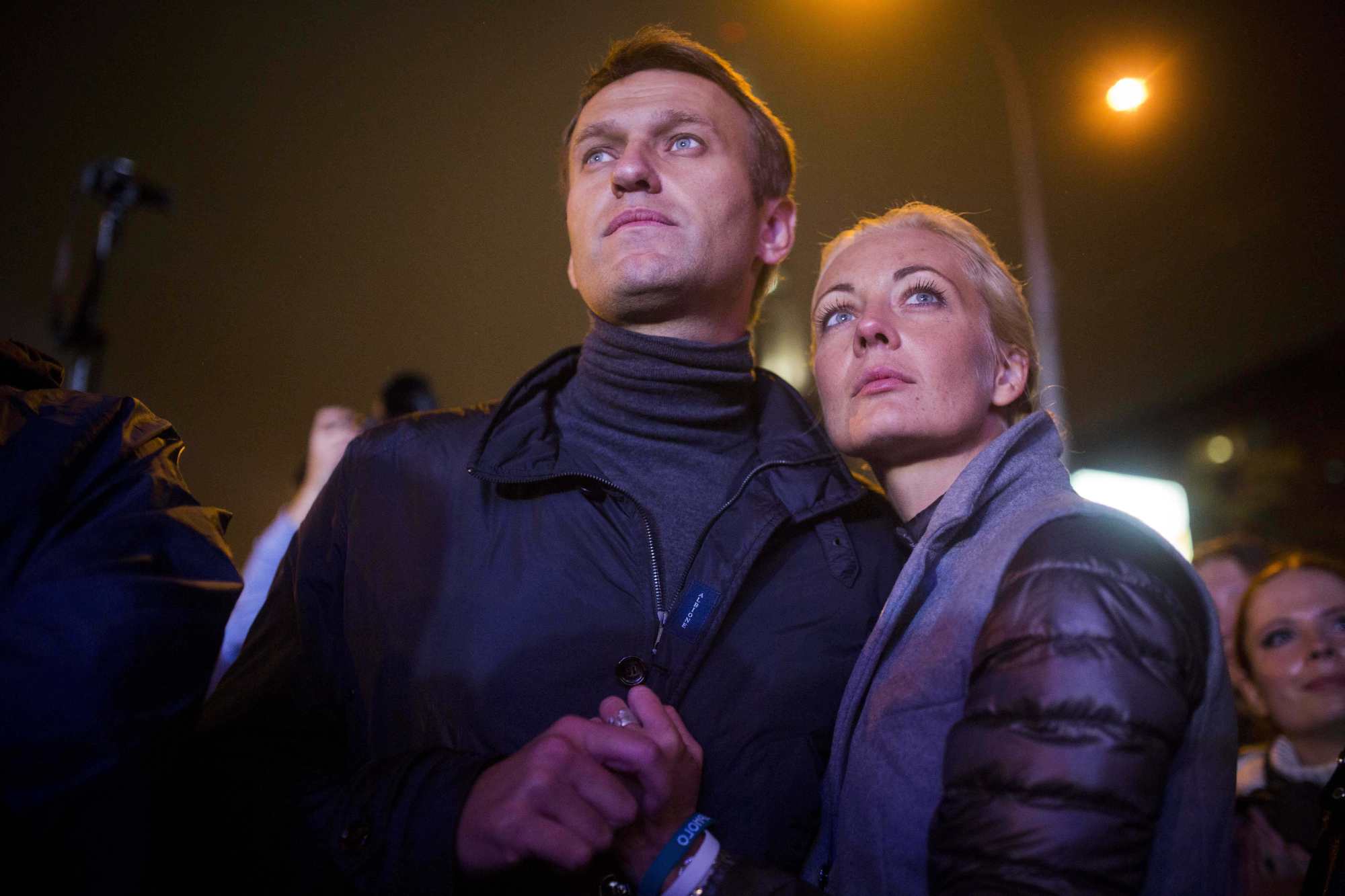 Russian opposition leader Alexei Navalny and his wife, Yulia, are seen after a rally in Moscow, Russia, in September 2013. Photo: AP