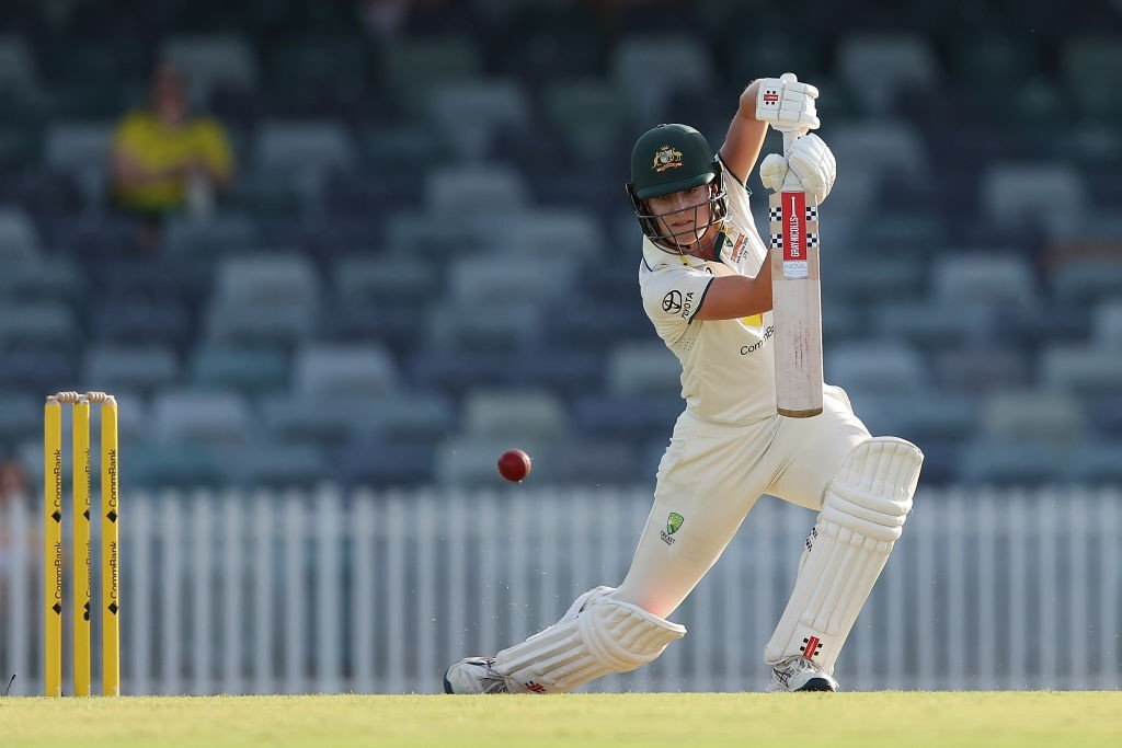 Australia batter Annabel Sutherland plays a cover drive and the ball is just bouncing away.