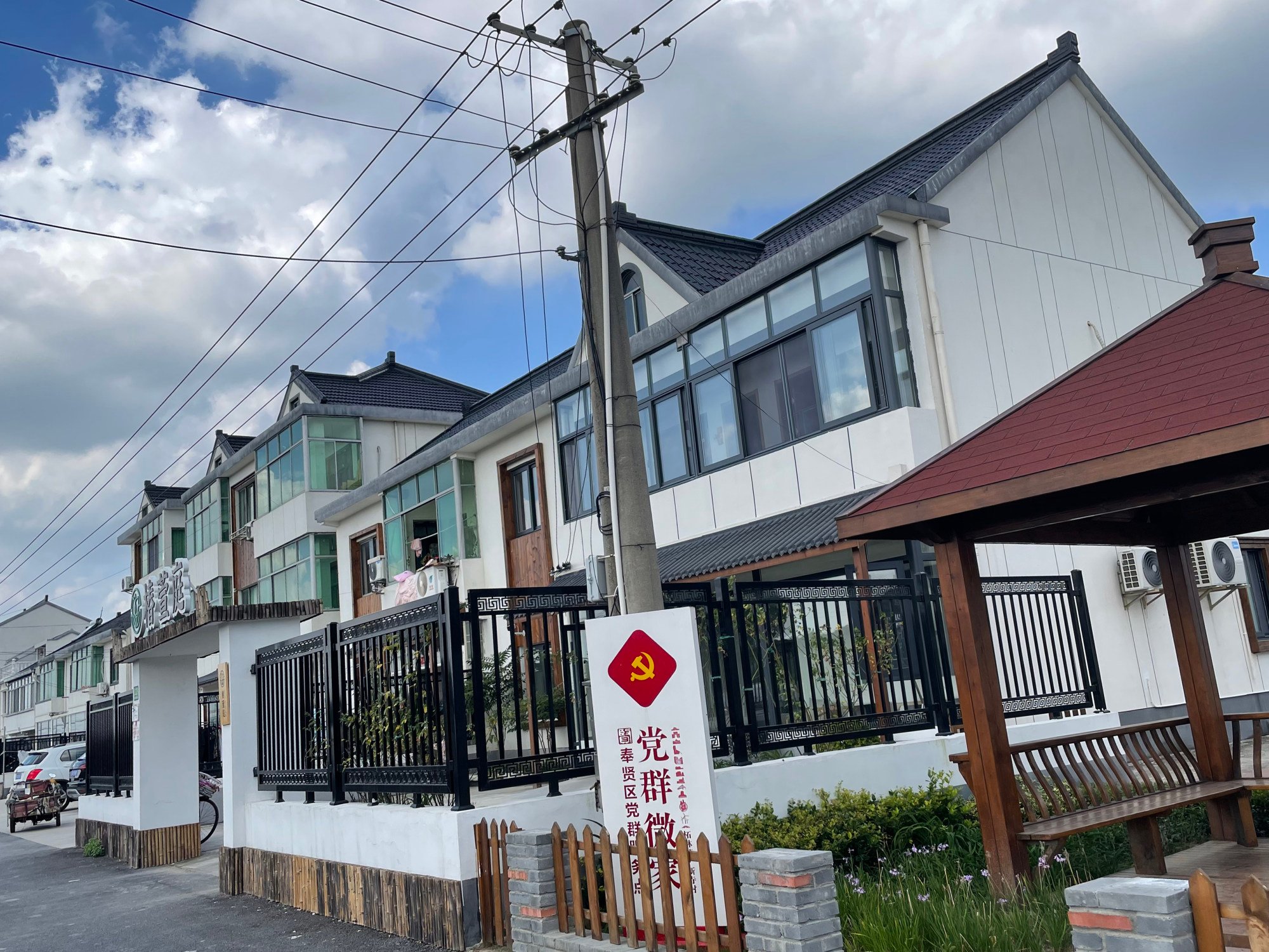 Chunxuanting, the two-story house with a fence, is an elder care facility within walking distance for residents of Xinsi village in Fengxian district, Shanghai. Photo: Mandy Zuo