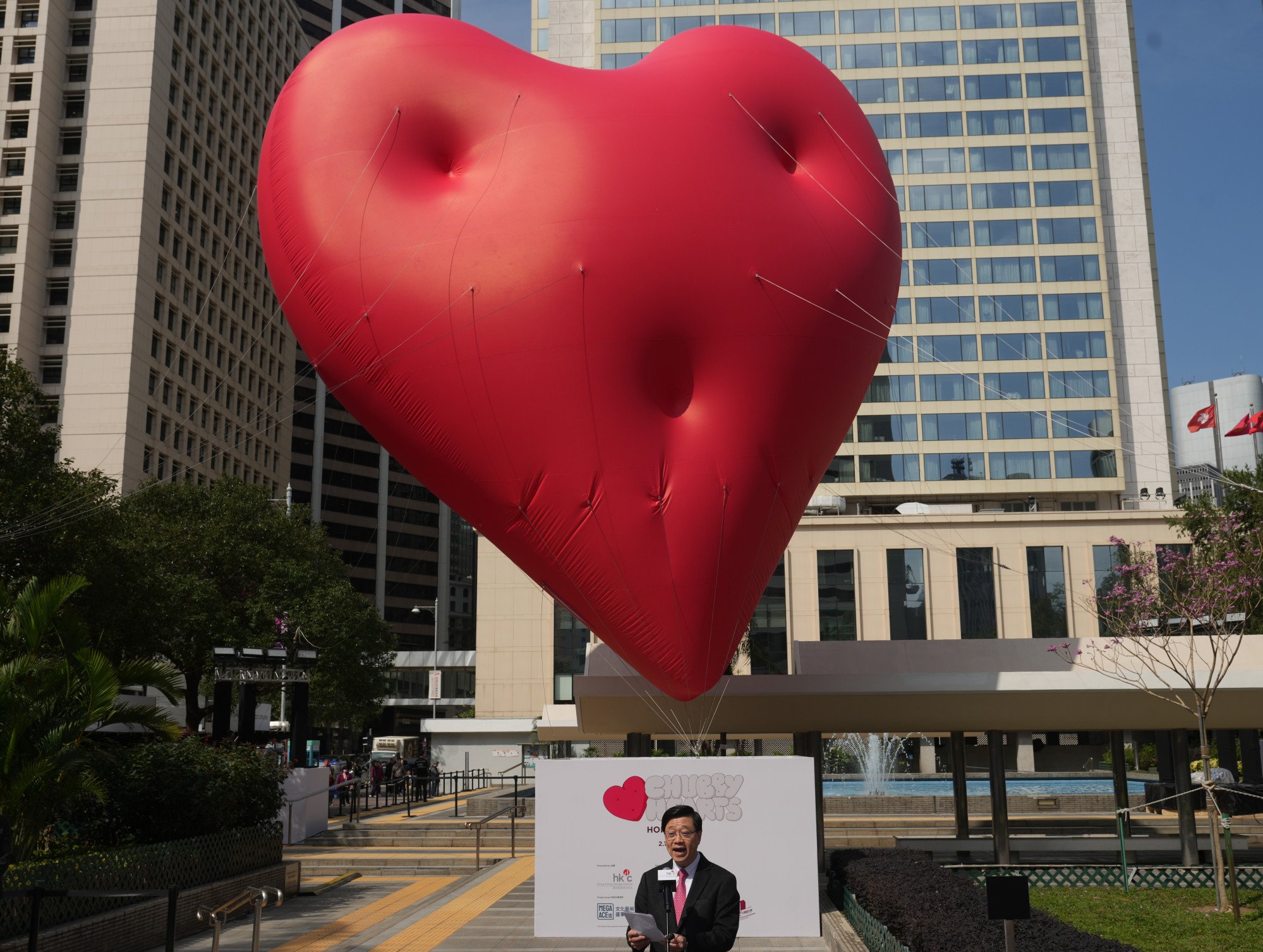 Chief Executive John Lee Ka-chiu launches the Chubby Hearts Hong Kong art installation by fashion designer Anya Hindmarch at Statue Square Gardens in Central on February 14. Photo: Sam Tsang