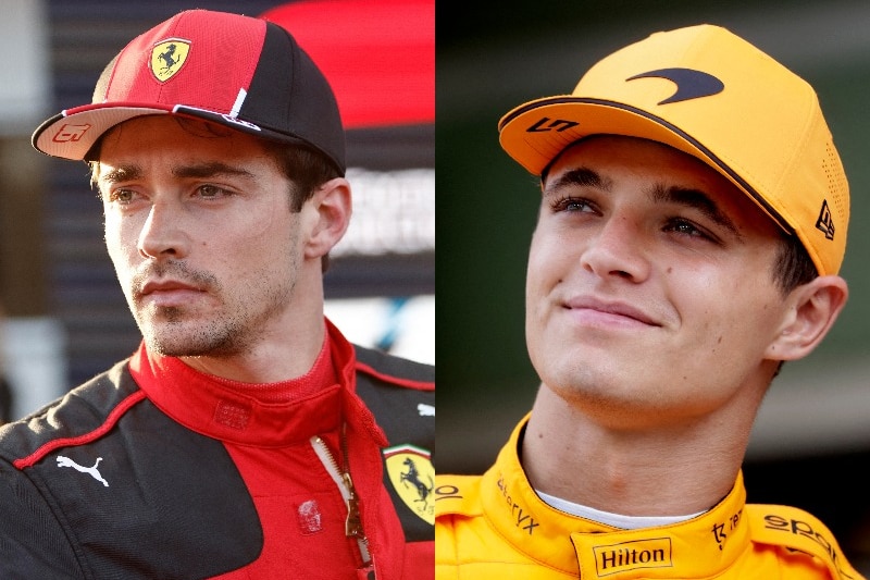 Two F1 drivers, one in red and the other in orange, in the paddock after a session