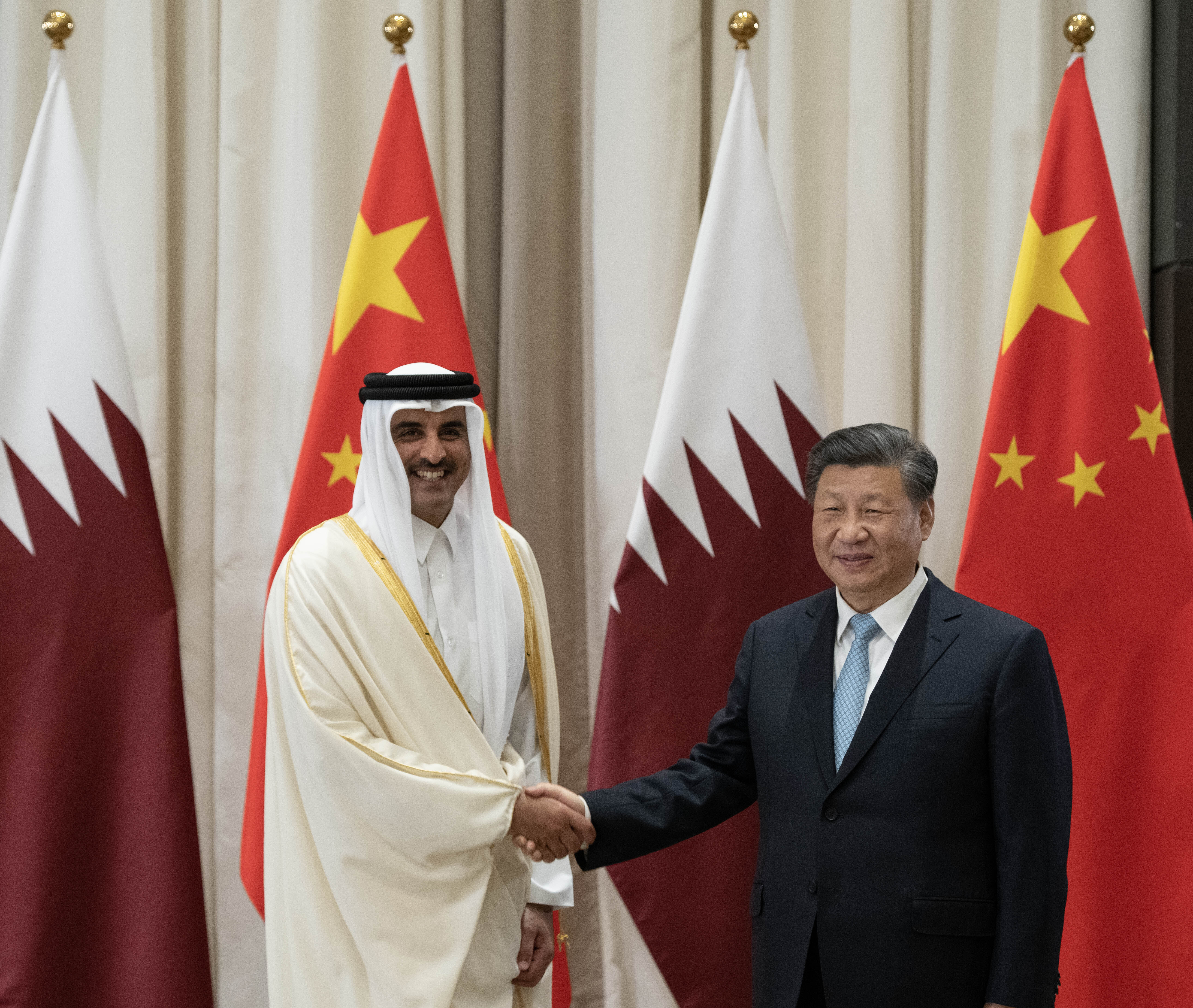 Emir of Qatar Sheikh Tamim bin Hamad Al-Thani (left) and Xi (right) meet in Riyadh, Saudi Arabia in December 2022