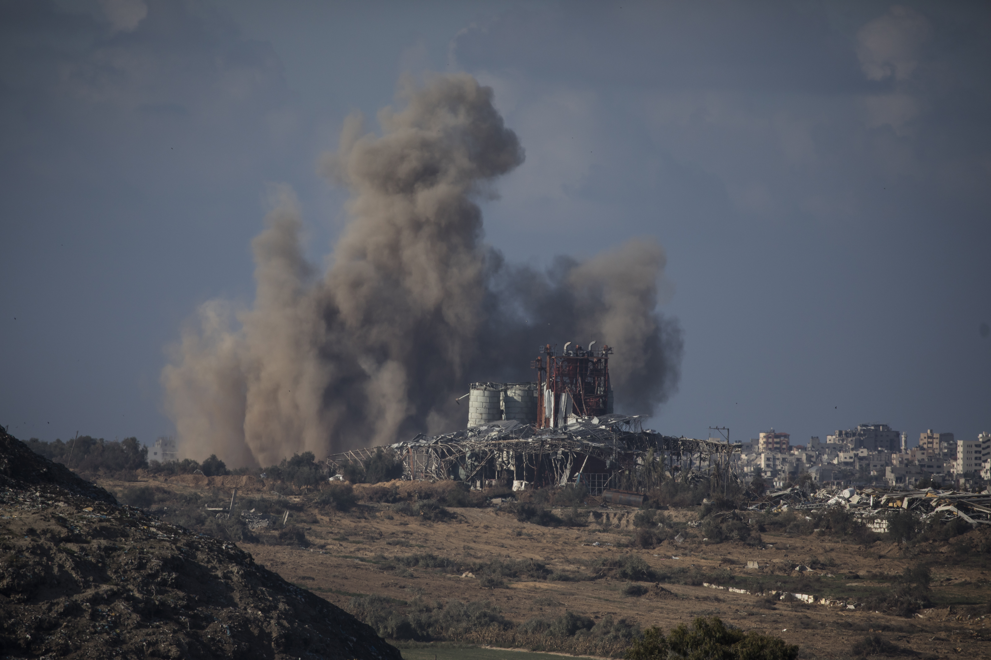 Smoke rises over Gaza during Israeli bombardment as seen from the Israeli side of the border in January 2024 in Southern Israel