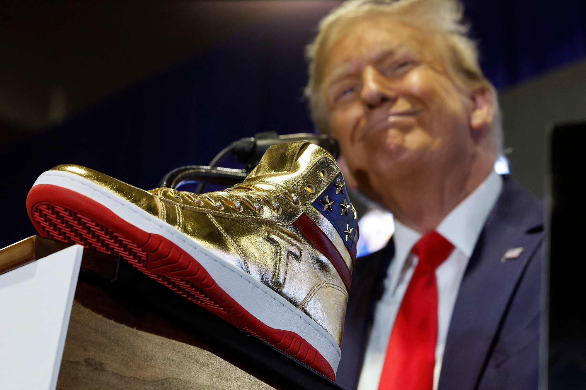 Republican presidential candidate Donald Trump delivers remarks while introducing a new line of signature shoes at Sneaker Con at the Philadelphia Convention Centre on Saturday. Photo: AFP