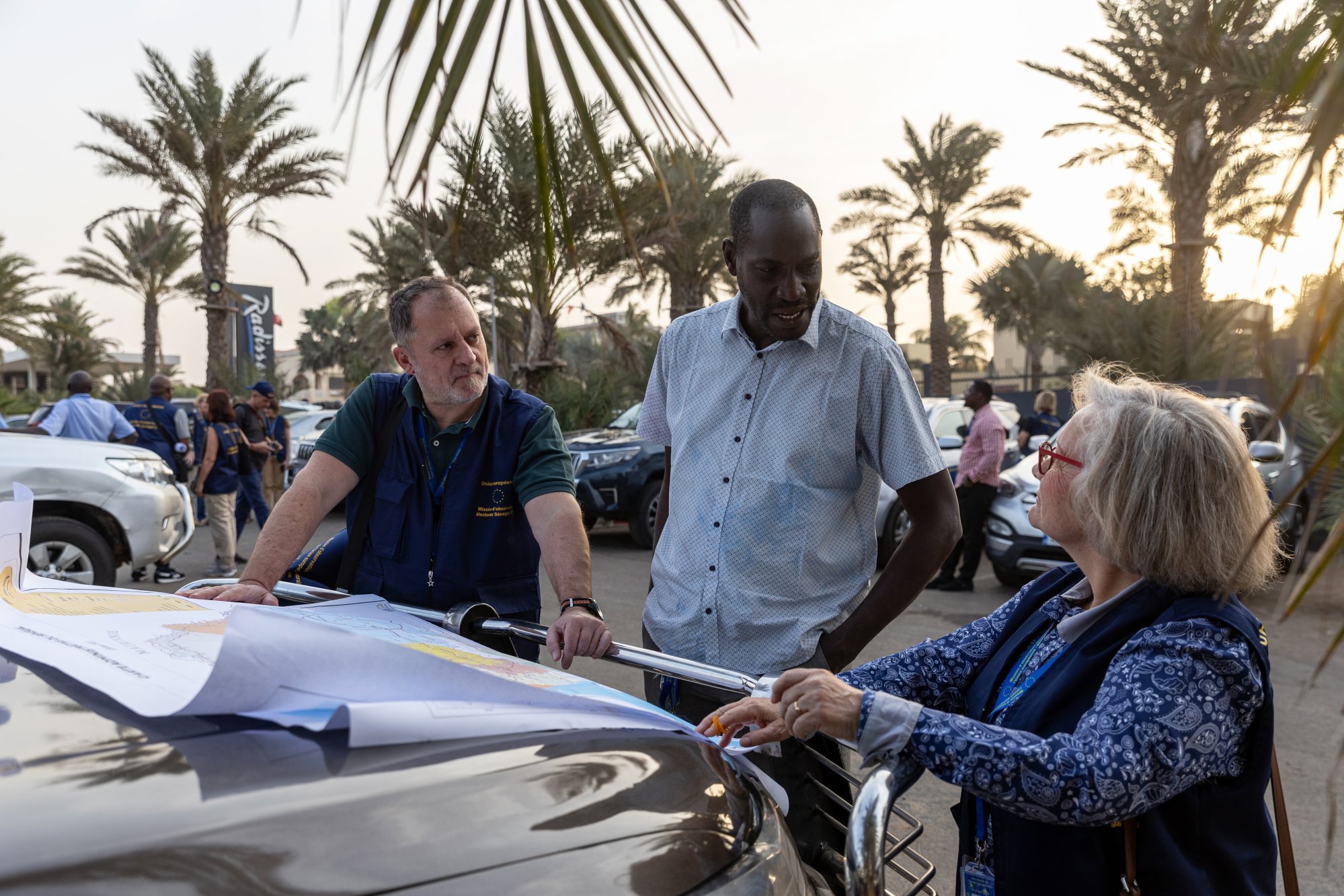 Election observers from the European Union study a map of Senegal before being dispatched to their respective locations in Dakar, Senegal on Friday. Photo: EPA-EFE